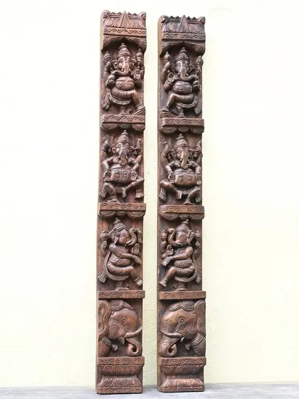 A pair of 4-foot vertical panels depicting the Ashta Ganesha, or eight forms of Ganesha. The dark wood finish gives these traditional carvings a bold and classic look, ideal for flanking a doorway or a main wall.