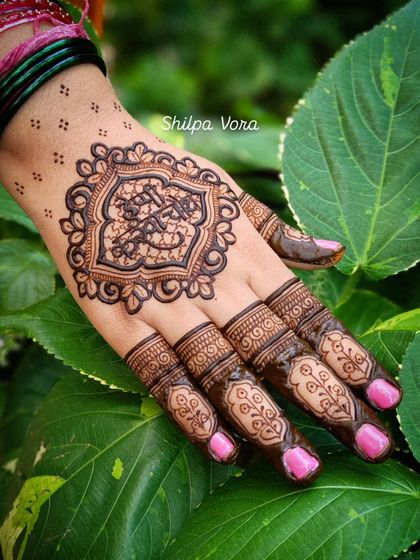 A unique design with a central motif containing Arabic calligraphy, blending tradition with personal expression.