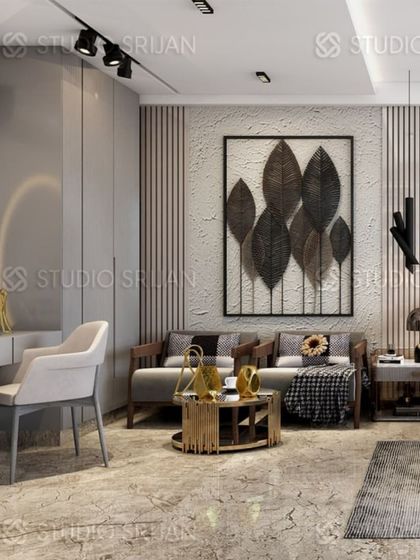 A seating area within the Rajouri Garden bedroom, featuring a comfortable two-seater sofa and a textured wall with a large, leaf-themed metal art piece.