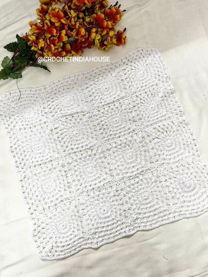 Another look at the square crochet table mat, highlighting the detailed stitch work. All my pieces are washable and made to last.