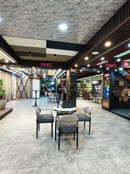 This wide-angle shot captures the scale of our showroom floor, with multiple consultation spots and product zones.