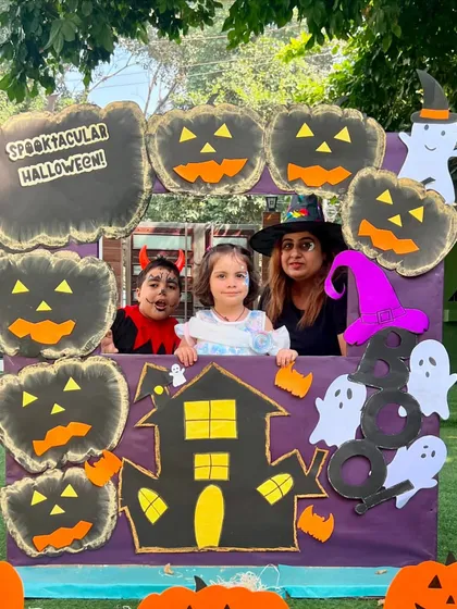Three happy faces at our Halloween photo booth. It's wonderful to see families getting into the spooky spirit with us.