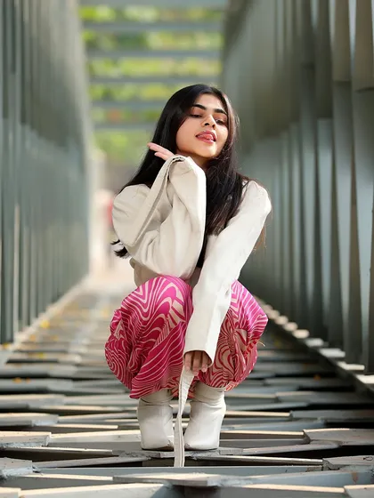 A playful and dynamic pose that breaks the mold. This low-angle shot on the bridge adds a unique perspective and a lot of personality to the fashion series.