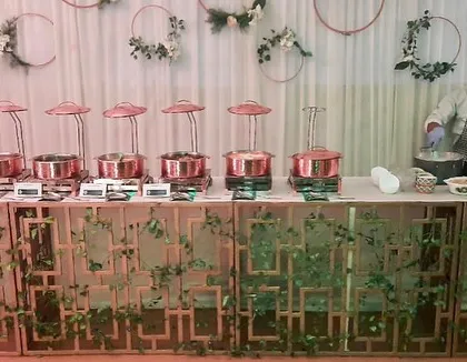 A beautifully decorated buffet counter for a Diwali party, showing my team at the live station, ready to create an exceptional experience.