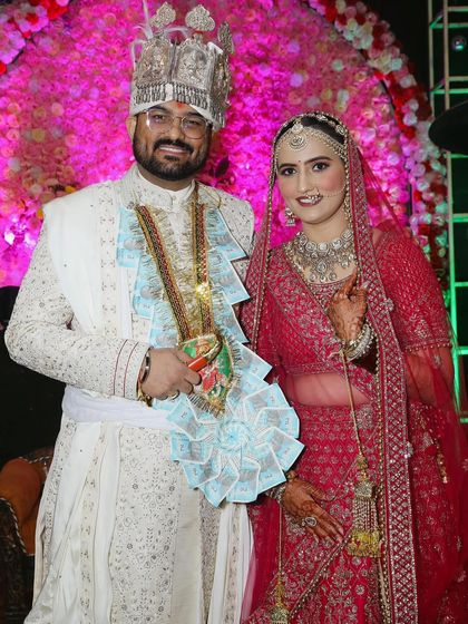 A beautiful couple portrait. The groom's currency garland is a fun part of many Indian weddings.