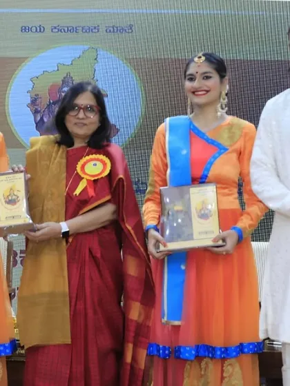 We are honored to be recognized for our art. Here, Alar and I are receiving mementos from Principal Chief Commissioner Smt. Preeti Garg and actor Sri Yash after a performance for Karnataka Rajyotsava.