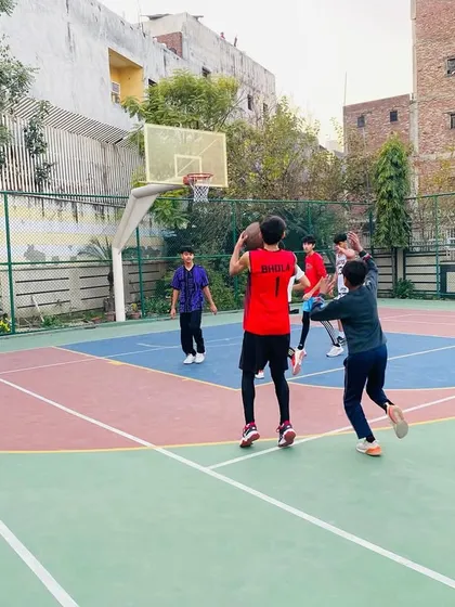 A player practices his shooting form, aiming for a perfect release.