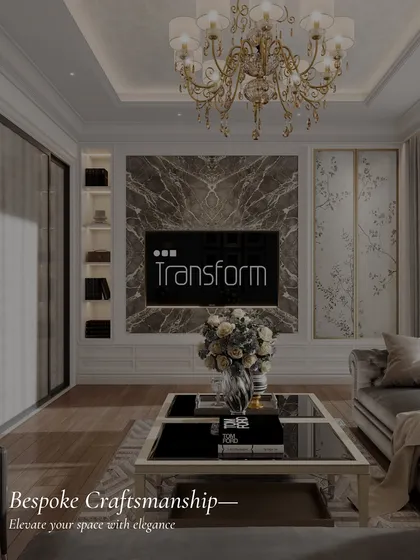 An example of bespoke craftsmanship, this living area features a TV framed by dramatic marble and flanked by custom shelving. The design elevates the space with elegance and functionality.