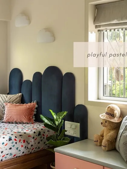 Designing for the youngest members of the family is always a joy. This daughter's bedroom in our 'Calm Abode' project uses a playful mix of pastels, a custom-designed headboard, and smart storage to create a fun, imaginative, and practical space that she can grow into.