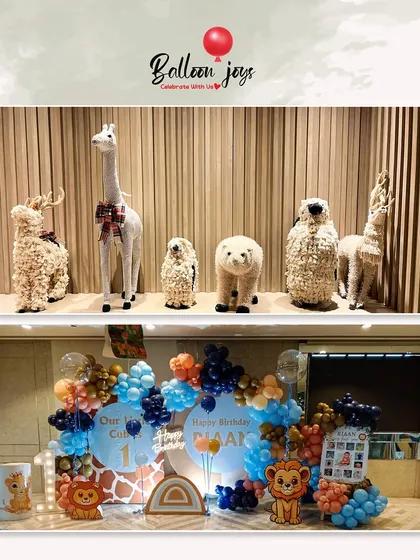 A wild one is on the way! This collage shows our adorable jungle animal theme, featuring cute animal props and a vibrant balloon setup in shades of blue, orange, and navy for a first birthday party.