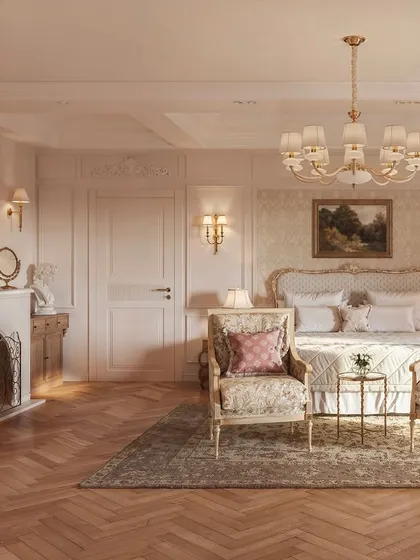 This view highlights the bedroom's classic fireplace and ornate mirror. These elements, combined with the detailed wall paneling and gilded furniture, create a sophisticated and romantic atmosphere reminiscent of a Parisian apartment.