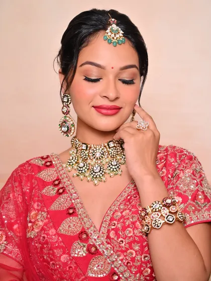 A close-up of a classic red bridal look created by a student. We focus on teaching clean blending, perfect lip shaping, and a radiant base.
