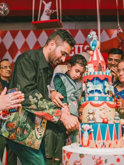 A close-up of the birthday boy and his parents during the cake cutting. The joy and love in this moment are what I aim to facilitate with every event I plan.