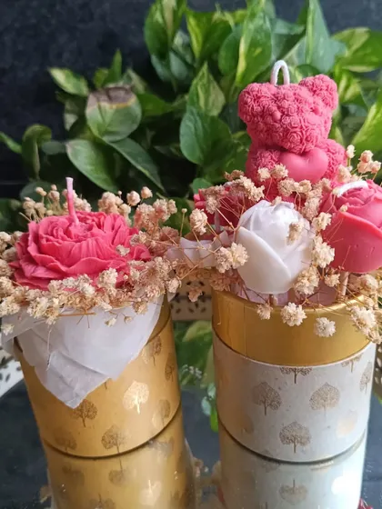 Two different styles of my wax flower bouquets, one with a large peony and the other with a teddy bear and roses.