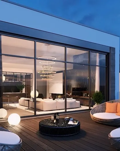 This prefabricated terrace lounge in Delhi NCR offers a complete, luxurious outdoor room. The design features floor-to-ceiling windows and comfortable, modern seating, providing a stylish retreat with panoramic views.