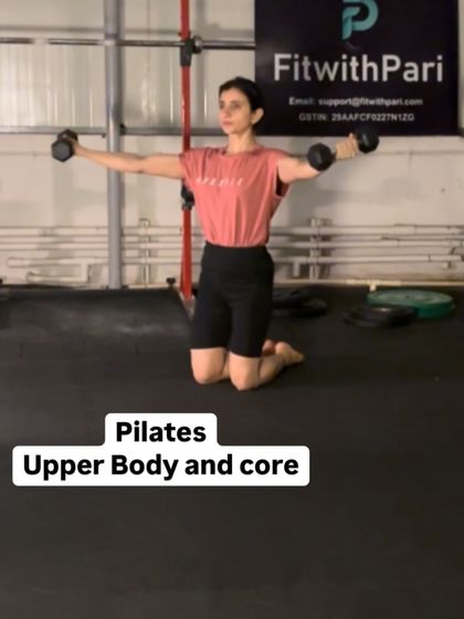 An image from our upper body and core Pilates session. This kneeling lateral raise with light dumbbells helps sculpt the shoulders while engaging the core to maintain a stable posture.