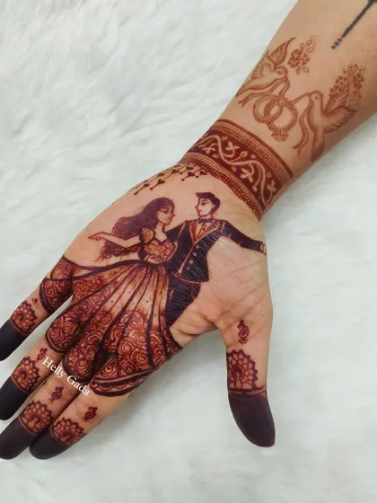 This is the beautiful, dark stain of the dancing couple design. It shows how the details become even more prominent and rich after the natural henna paste is removed.