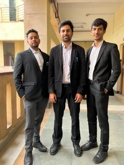 Three of us in our professional attire, ready for the day. We represent clients in various courts, including the Delhi High Court and Supreme Court.