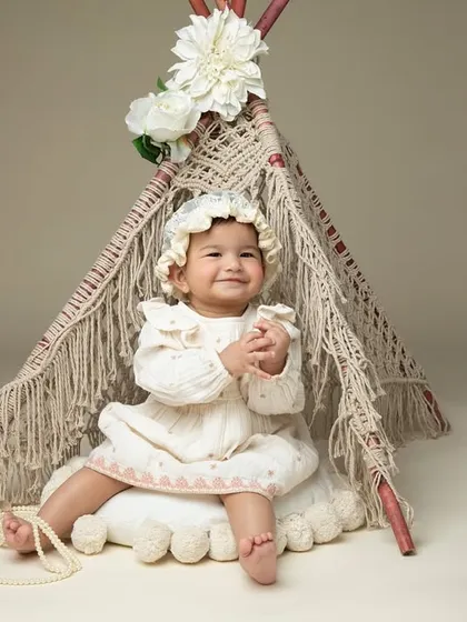 A boho-themed sitter session, with a cute macrame teepee. This little one's happy expression shows how much fun we have in the studio.