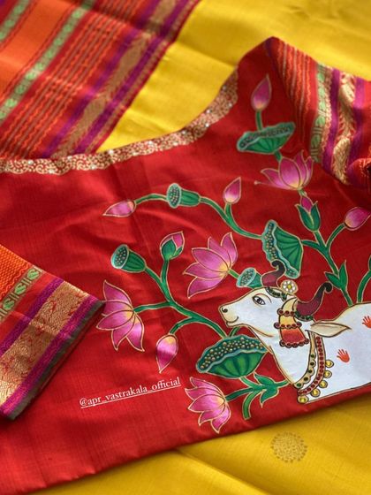 A beautiful hand-painted blouse depicting a holy cow amidst lotus flowers. This is a classic Pichwai art style, adapted for a wearable blouse.