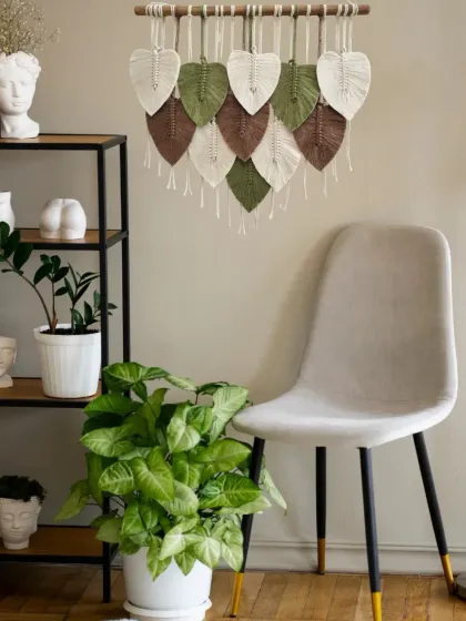 Where artistry meets nature. This macrame leaf hanging, styled in a modern bohemian room, blends soft fibers and earthy colors to evoke a sense of peace, warmth, and natural elegance.