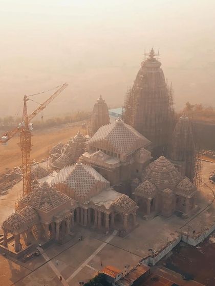 An aerial view of the Kundalpur Jain Temple under construction, showing the grand scale and intricate design of this future spiritual landmark.