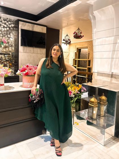 Feeling very Grecian in this one-shoulder, pleated jade green dress. It's a perfect example of a summer statement piece that is both elegant and comfortable.