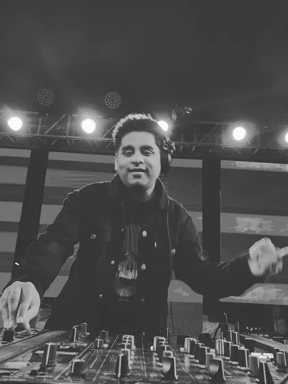 A black and white shot capturing the mood of a late night set. The lights, the music, and the crowd all come together to create a memorable experience.