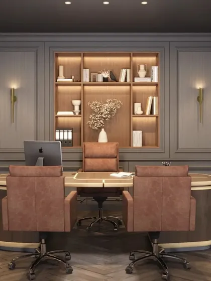 The executive desk area in the Mainee Steel Works office, designed for presence and productivity. The space features custom cabinetry with integrated lighting, classic wall paneling, and ergonomic seating, all contributing to a highly functional and sophisticated workspace.