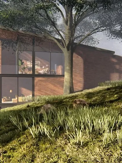 This conceptual image shows the Atlanta Wellness Home nestled in a misty forest, emphasizing its design as a quiet retreat that is grounded in and respectful of its natural setting.