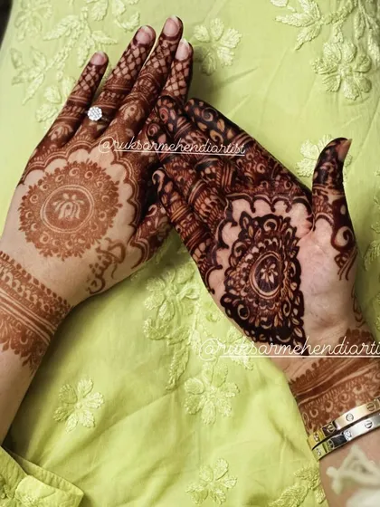 A side-by-side comparison of a fresh design and a fully developed stain on a mandala pattern.
