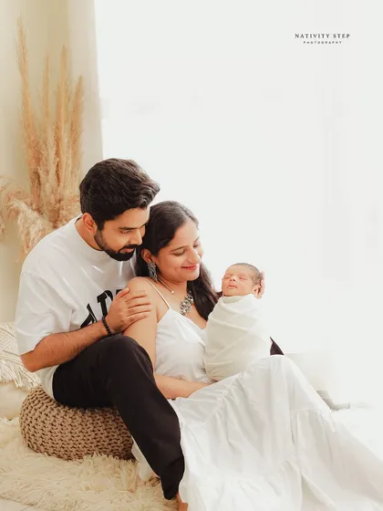 A bright and beautiful family portrait that feels natural and full of light. We guide you into comfortable poses that let your love for your new baby shine through, creating a memory of your first days as a new family.