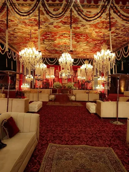 I designed this lounge to feel like a modern palace hall, with a ceiling of printed fabric and pearls, dozens of crystal chandeliers, and plush seating for a truly opulent experience.