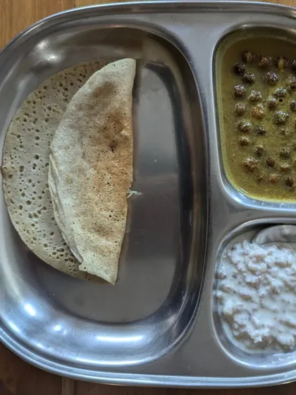 A simple yet satisfying meal of dosa with kala chana curry and peanut curd. This plate shows how traditional Indian meals can be balanced, delicious, and completely plant-based.