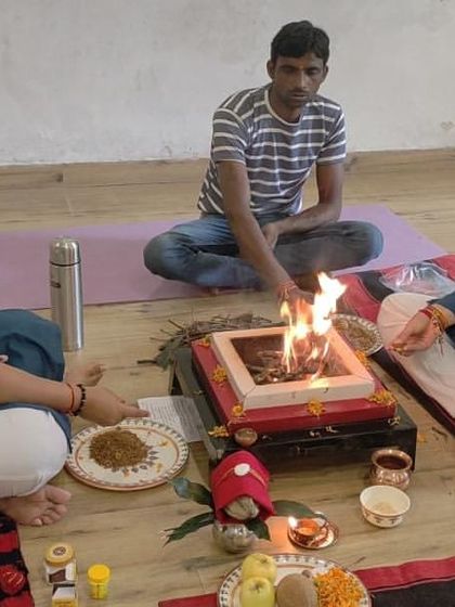 We perform Hawan to infuse divinity, sanctity, and positivity into everyone's life. This image shows participants in our Delhi studio taking part in the purifying ritual.