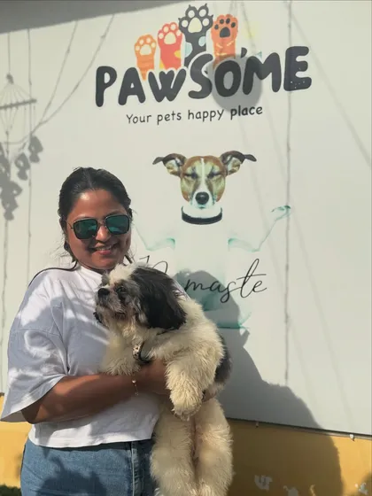 Happy clients make me happy. This owner is all smiles holding her sweet Shih Tzu.