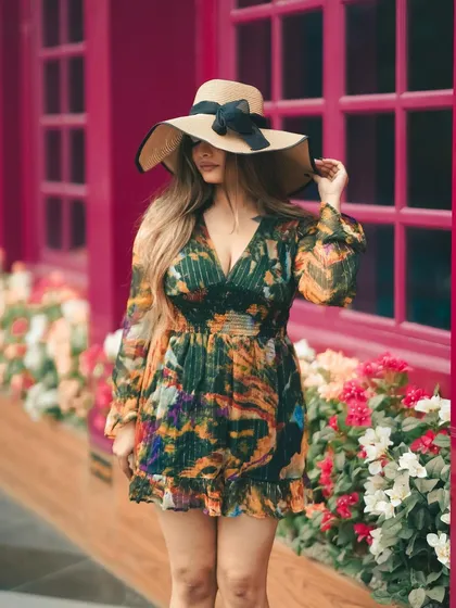 This colorful backdrop feels like a street in London. We used the vibrant location to complement the floral dress, creating a cheerful and stylish fashion portrait.