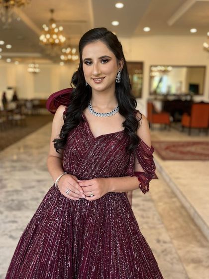 A cocktail stunner in a beautiful wine-colored gown. I created a soft, smoky eye and a neutral glossy lip to complement the rich tones of her dress.