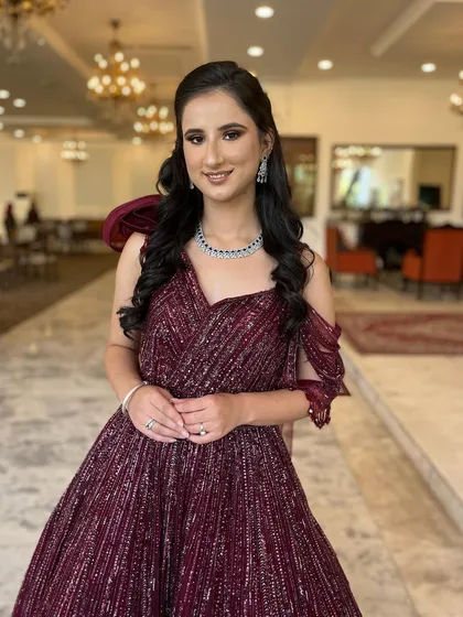 A full-length shot of this elegant cocktail look. The makeup is sophisticated and glamorous, perfect for an evening event.