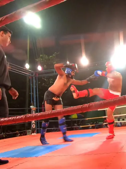 A solid leg kick is delivered by our fighter during his silver medal match.