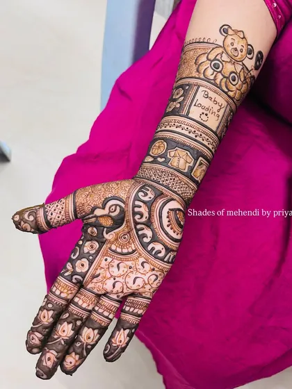 A lovely baby shower design with a "Baby Loading" message on the arm. The design also includes a cute teddy bear and other baby-related motifs.