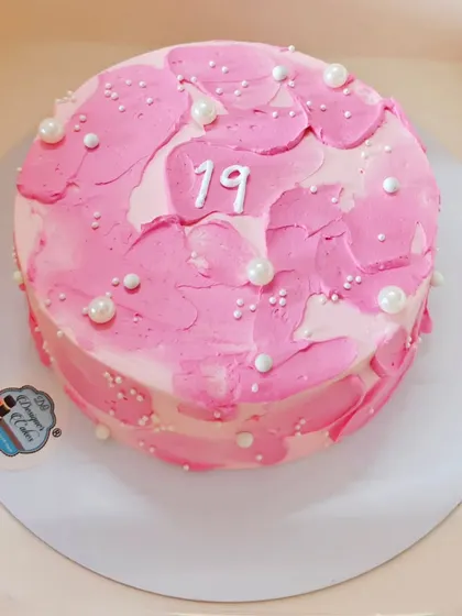 A simple pink bento cake with a textured finish and pearl details, celebrating a 19th birthday. Perfect for a small, personal celebration.