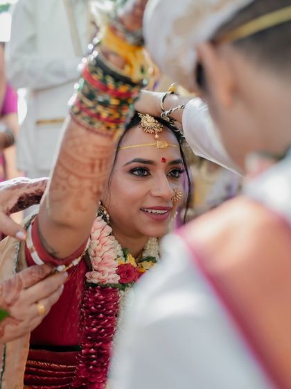 A precious moment during the wedding ceremony. The makeup is designed to be tear-proof and hold up through all the emotional moments of the day.