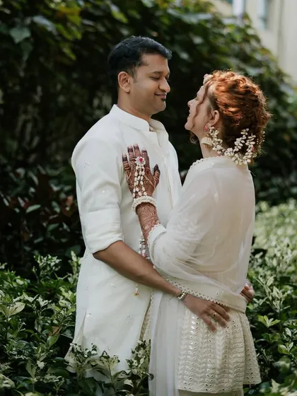 A sweet moment between the couple, both dressed in their elegant ivory Haldi outfits. The simplicity of the color palette allowed their happiness to shine through.