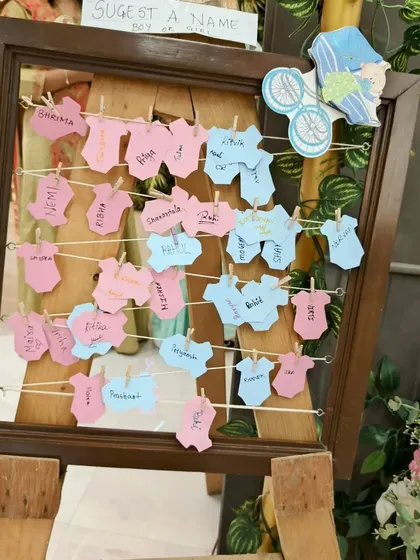 A fun and interactive "Suggest a Name" board at a baby shower. It's these little personal touches that make an event memorable.