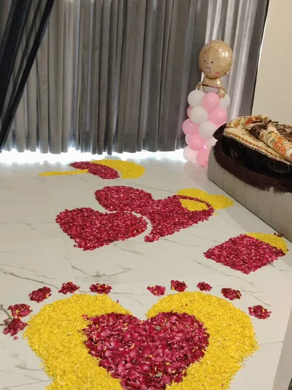 Flower petal art on the floor as part of a welcome home celebration.