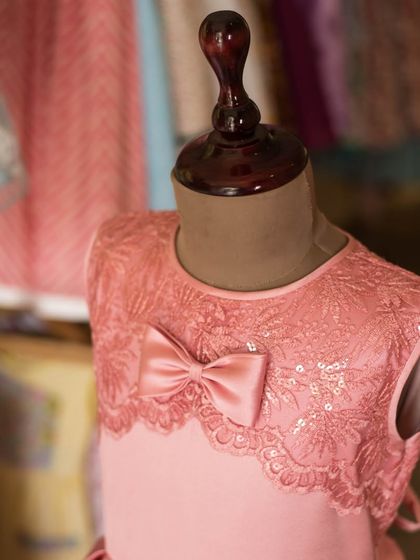 A close-up of the delicate lace and sequin work on the bodice of this pink dress. I love adding a little sparkle to make a dress feel extra special.