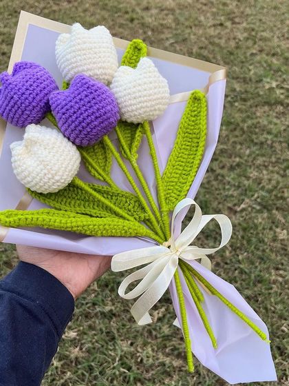 Our 'Lilac Love' bouquet, featuring five purple and white tulips, looks beautiful against a natural backdrop. A perfect, simple, and elegant gift.