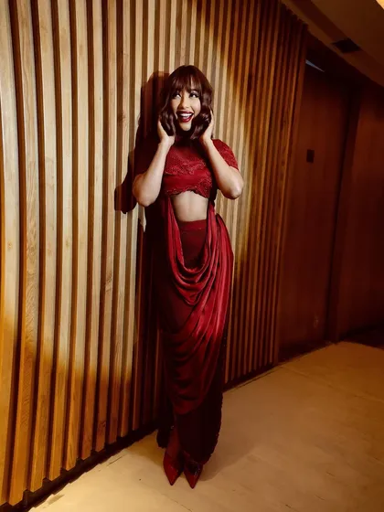 A striking crimson cowl-drape two-piece set that blends fluid elegance with confident structure. Crimson is a color of passion and presence.