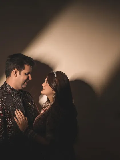 Using light and shadow to create a dramatic and intimate portrait. This technique highlights your connection, drawing the eye to the tender look shared between you, creating a mood that is both artistic and deeply romantic.